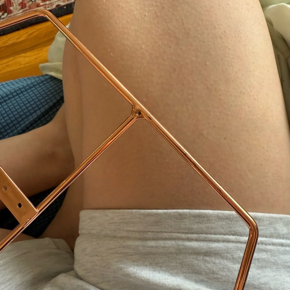 Rose gold jewelry holder with earring holes